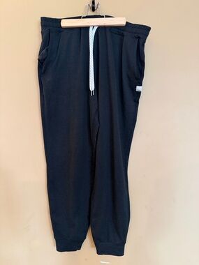 Vuori Black Sweatpants with White Logo Tab